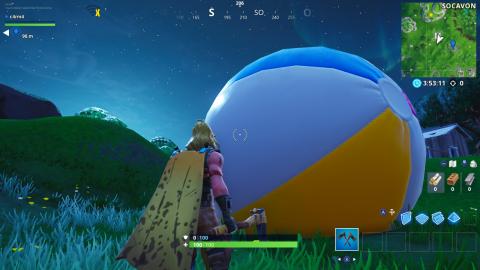 Throw a giant beach ball in different games in Fortnite (14 days of summer)