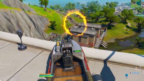 Jump through different flaming circles with a speedboat in Fortnite, Shipyard Deal